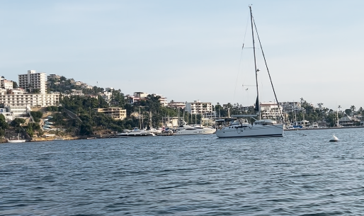 Sailboat anchored in Acapulco, Mexico, during an owner-aboard sailboat delivery captained by Jeff Vegas.